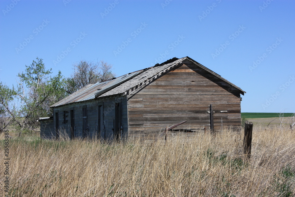 An old ranch with an old barn no longer used. An old ranch with an old barn no longer used.