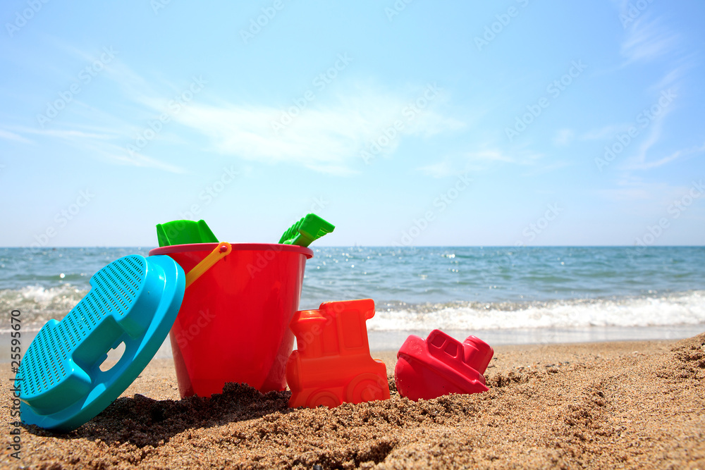 colorful plastic toys at the beach colorful plastic toys at the beach