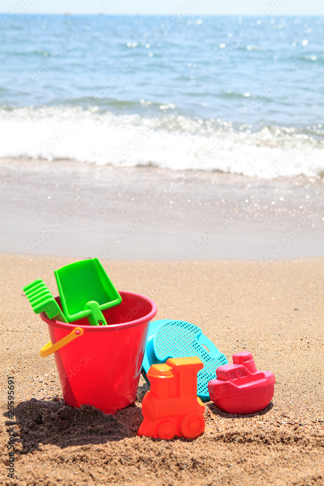 colorful plastic toys at the beach colorful plastic toys at the beach
