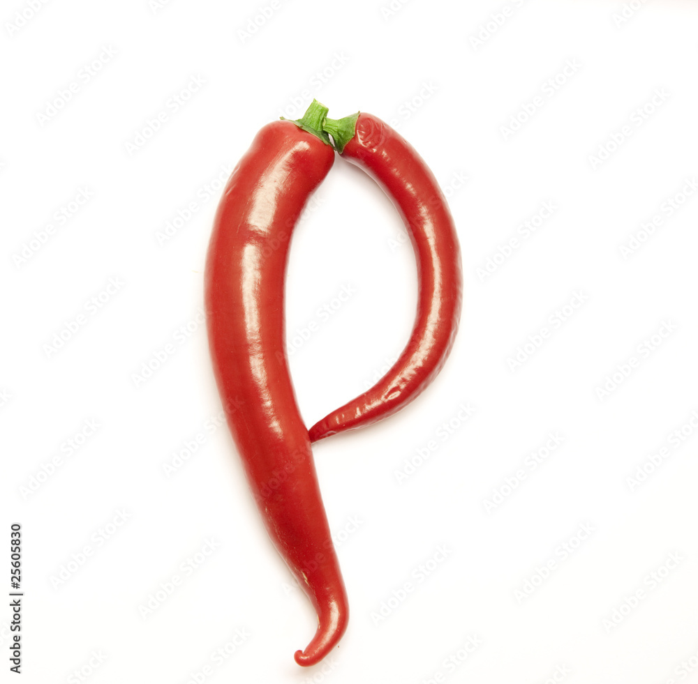 Letter made from red peppers over white backround Letter made from red peppers over white backround
