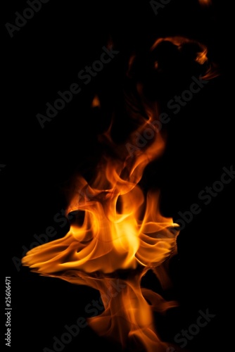 Beautiful stylish fire flames reflected in water © Nejron Photo