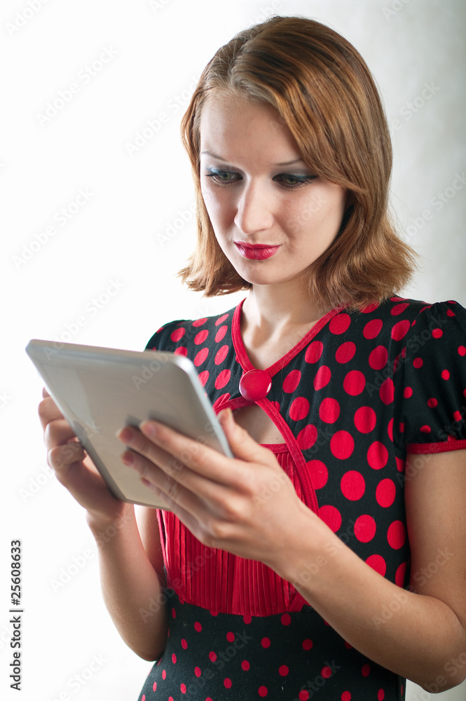 girl and computer on light background