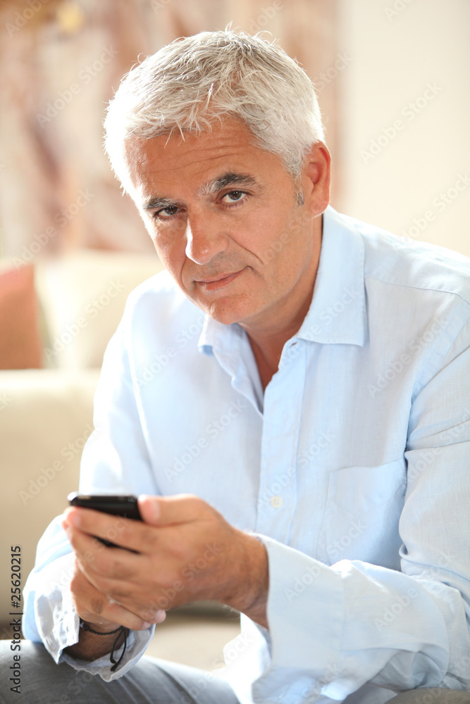 Closeup of senior man with mobile phone Closeup of senior man with mobile phone