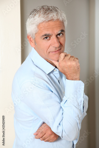 Wallpaper Mural Portrait of smiling senior man at home Torontodigital.ca