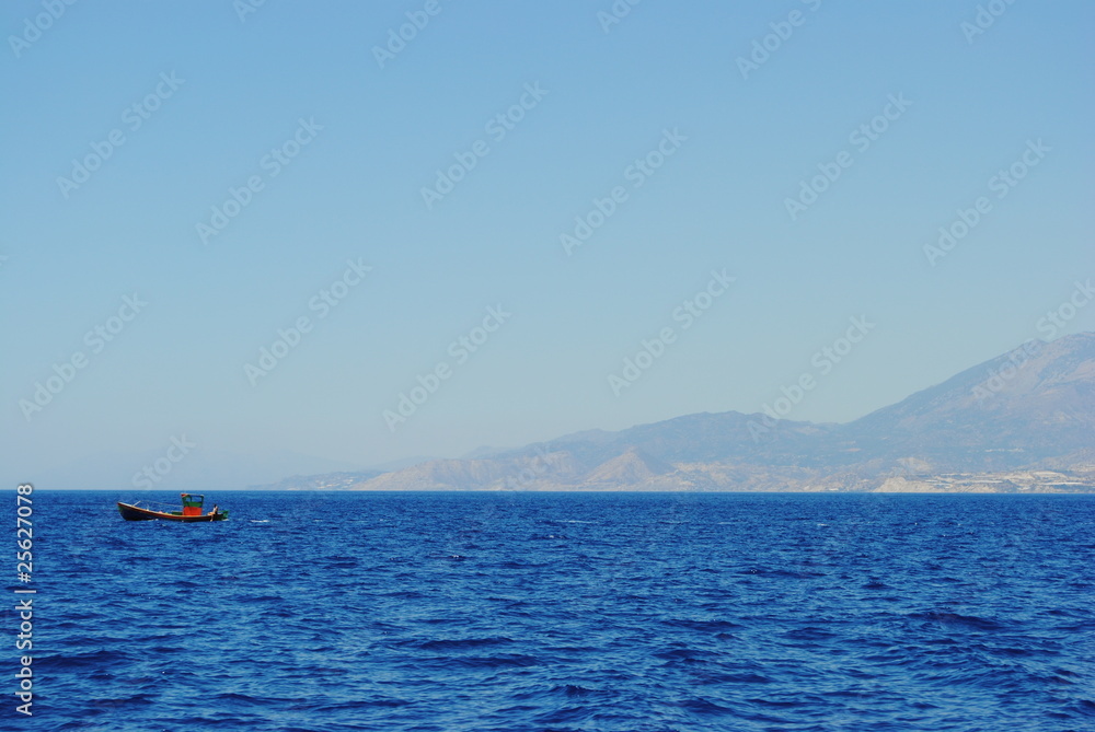 Boat floating off coast