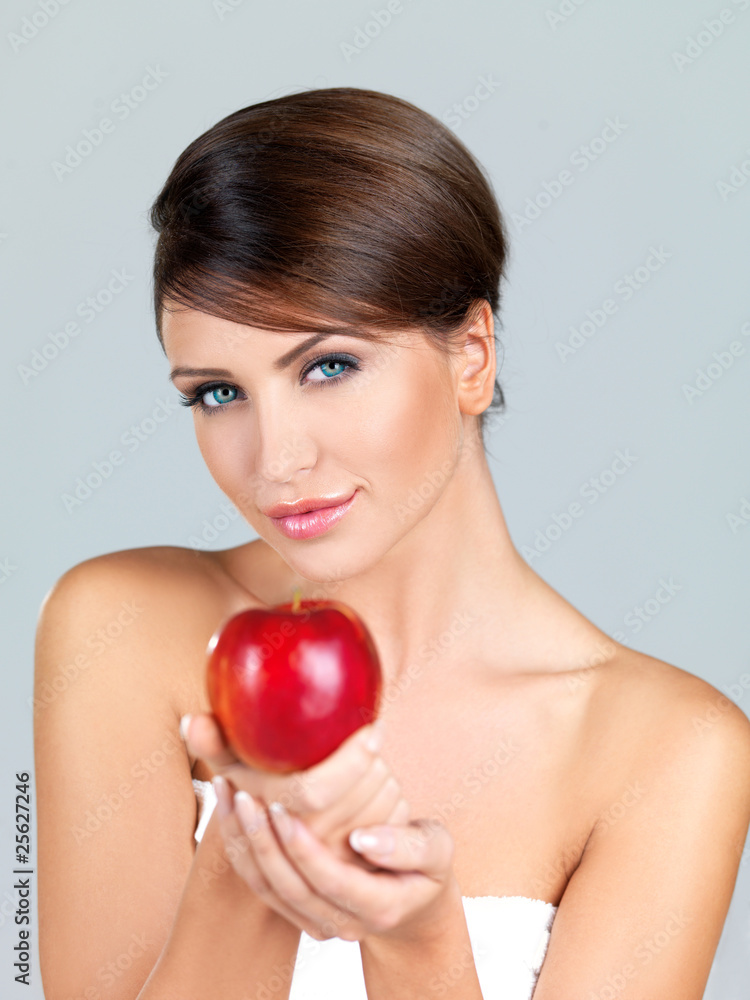 Portrait of beautiful woman, she holding red apple Portrait of beautiful woman, she holding red apple