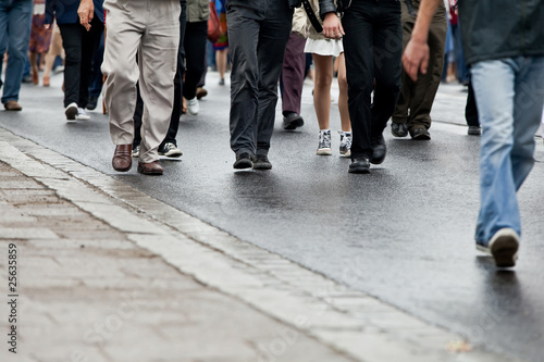 Crowd walking - group of people walking together (motion blur)