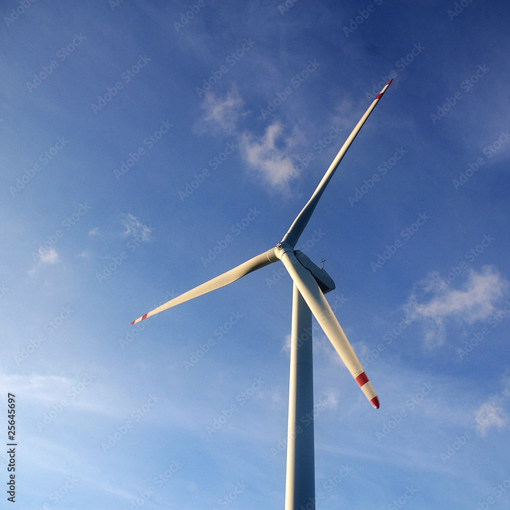 Fototapeta premium Wind turbine under blue sky