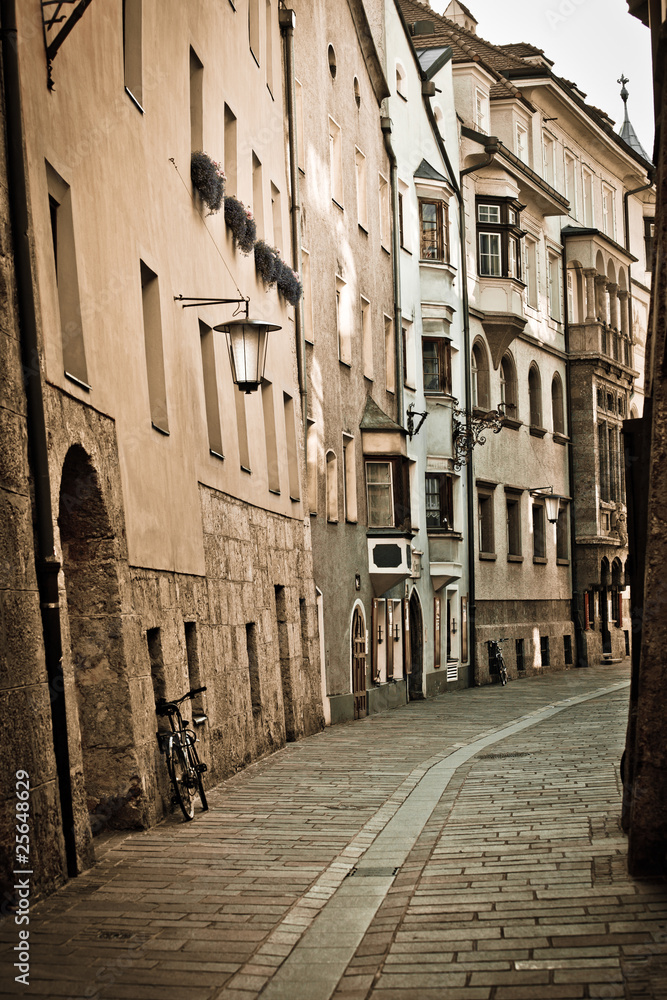 Retro style photo of typical european old town street