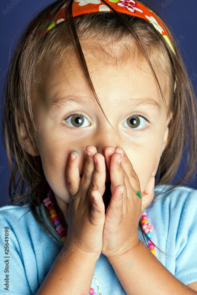 Funny little girl on blue background. Funny little girl on blue background.