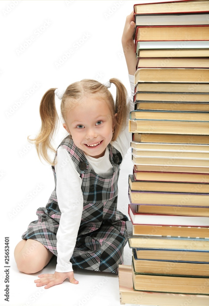 cute funny little schoolgirl hiding behind the books cute funny little schoolgirl hiding behind the books