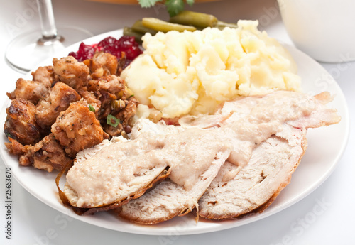 Sliced turkey breast with mashed potatoes and stuffing