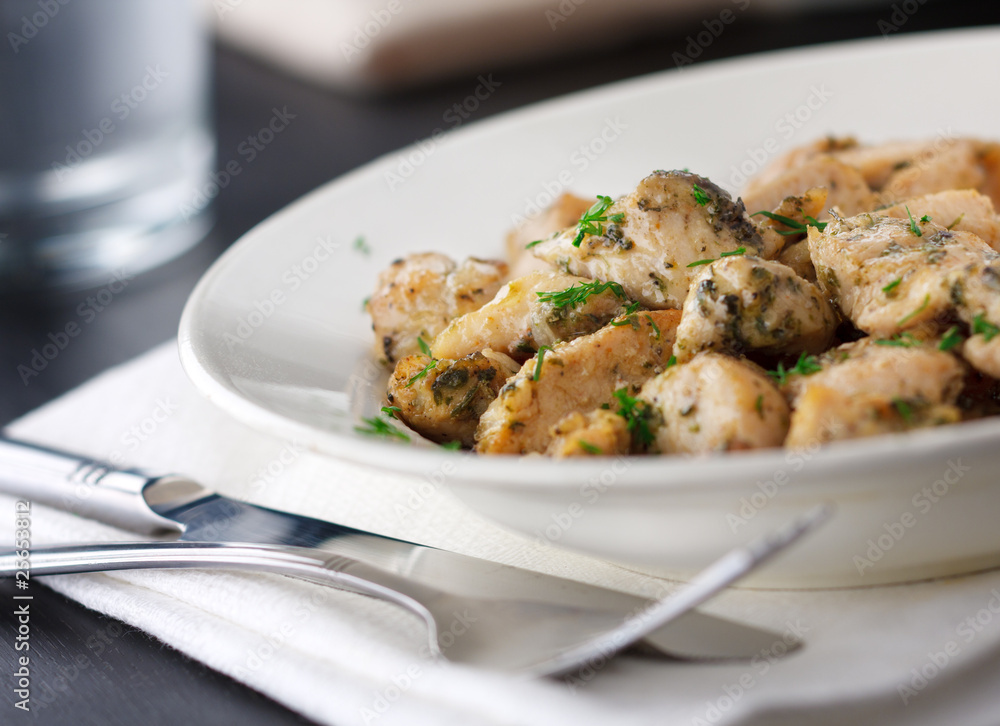 Chicken stew with dill on the plate Chicken stew with dill on the plate