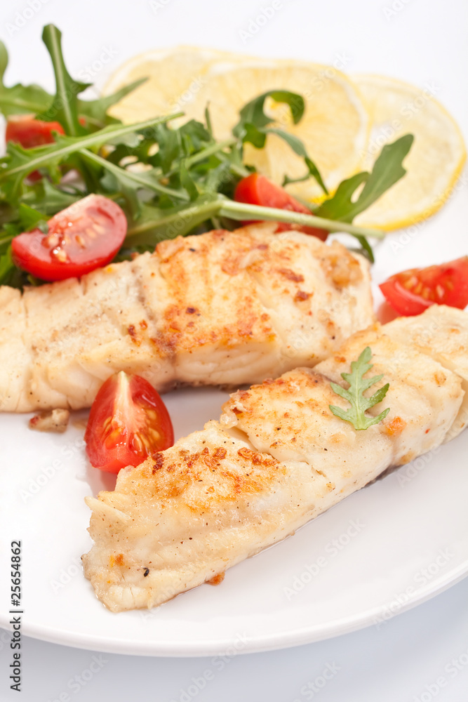 white fish with vegetables and lemon