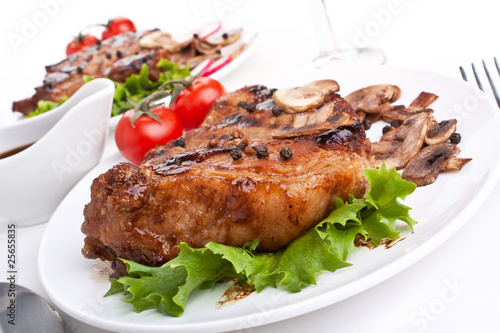 servings of pork chop with mushrooms and vegetables