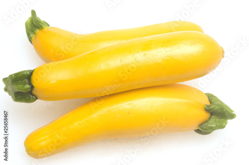 three yellow zucchini squash