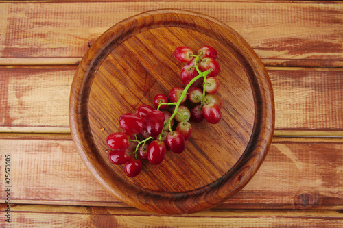 red grape on wood