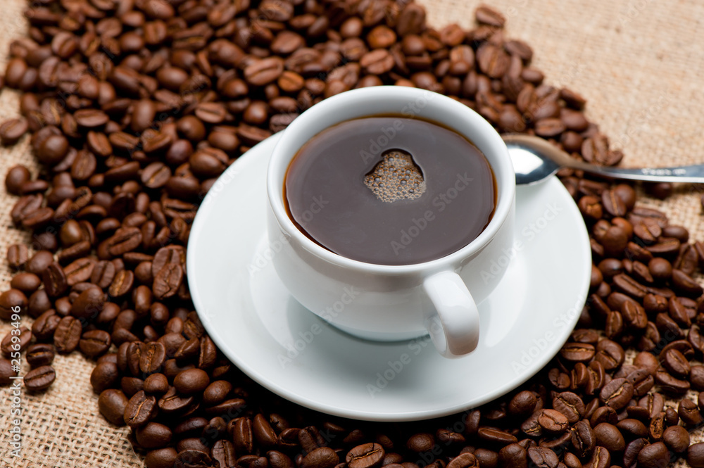 Cup of coffee on coffee grains Cup of coffee on coffee grains