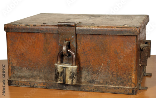 Vintage strongbox of brown color with the lock.