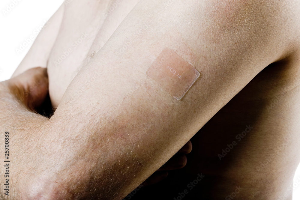 Man arm with healing patch Man arm with healing patch