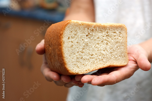 Bread in hands.