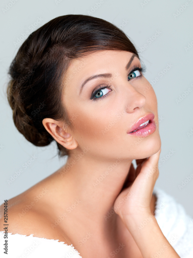 Portrait of beautiful woman, she is isolated on grey Portrait of beautiful woman, she is isolated on grey