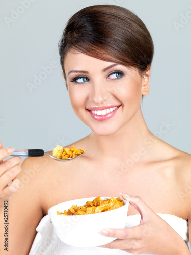 Portrait of beautiful woman, she eating cornflakes