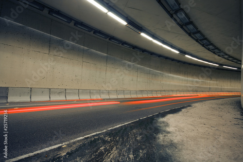 Car lights trails in a tunnel