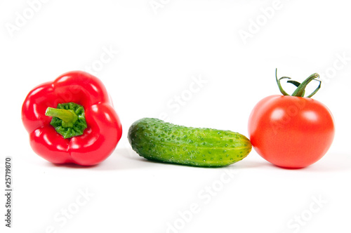 red pepper, tomato and green cucumber isolated
