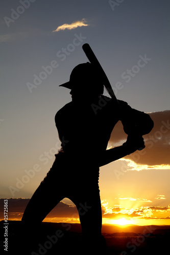 Silhouette baseball ready to swing sunset