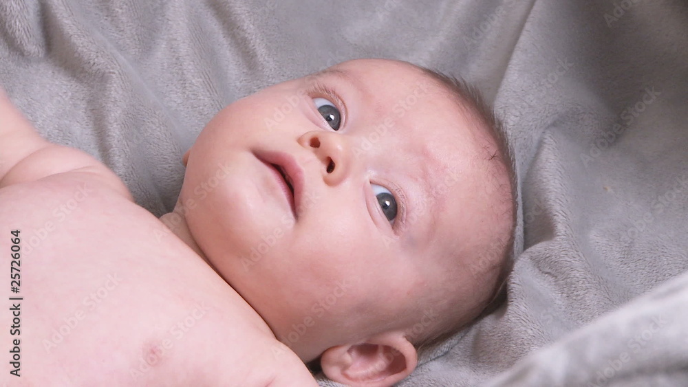 Portrait of three month old baby laying on back Portrait of three month old baby laying on back