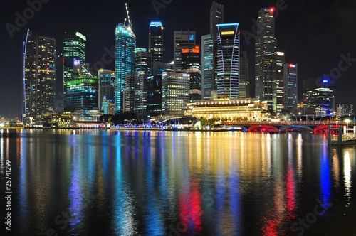 Cityscape by Marina bay with colourful light reflection