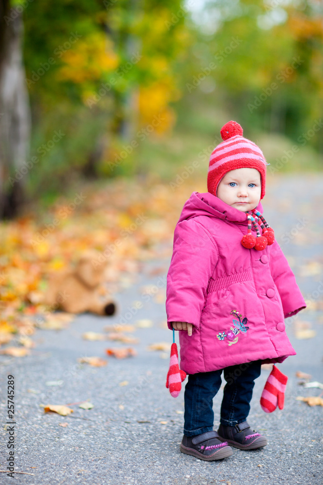 Toddler girl outdoors on autumn day Toddler girl outdoors on autumn day