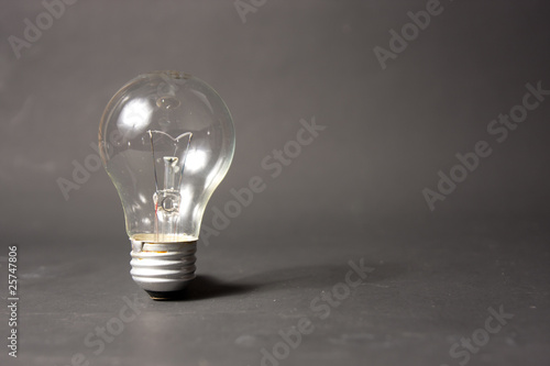 light bulb alone in black backbround
