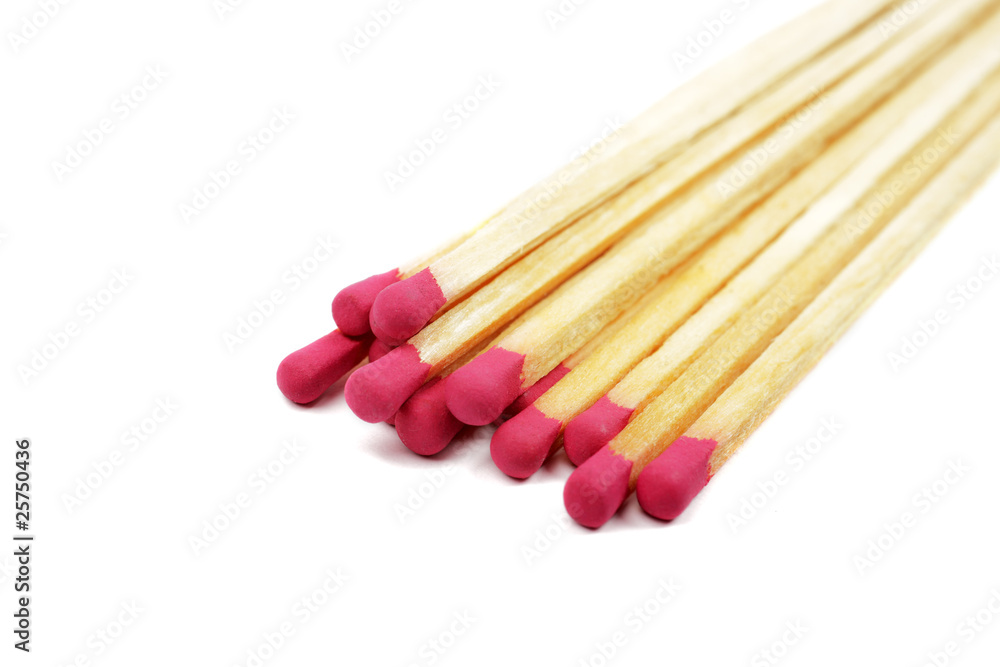 Heap of long wooden matches isolated on white background.