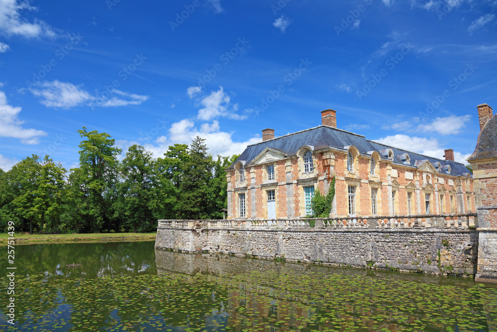 Old french mansion with a lake nearby, Europe.
