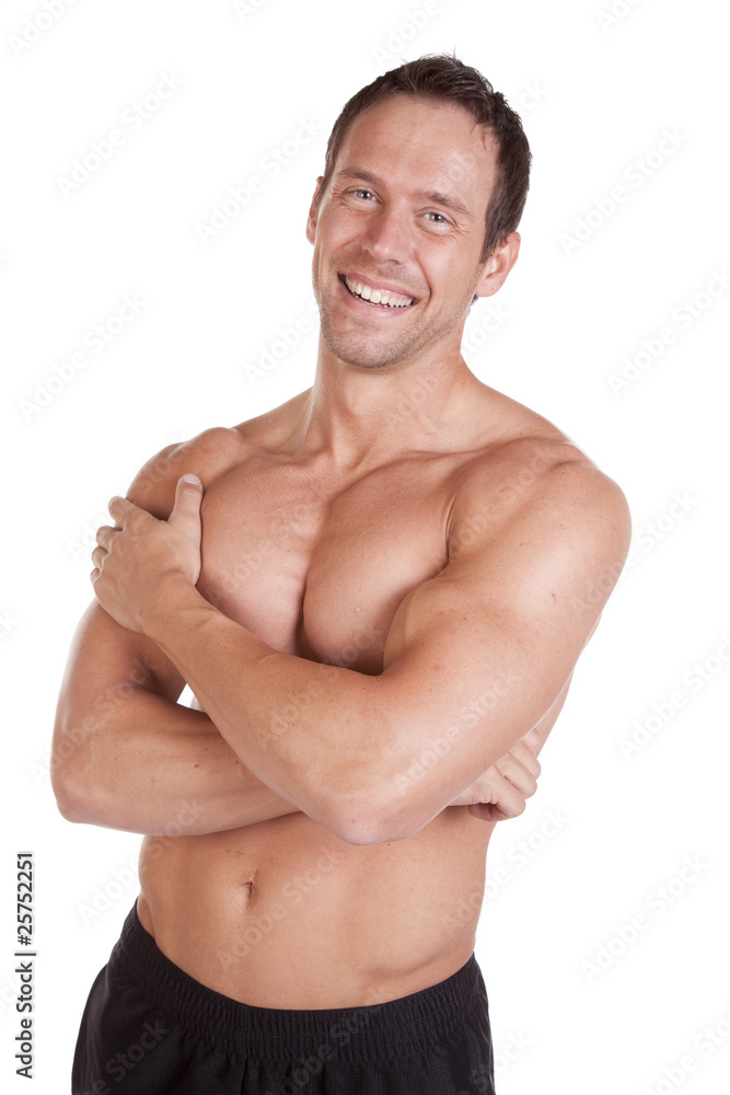 Muscular man keeping arms crossed Stock Photo by ©gstockstudio 75617291