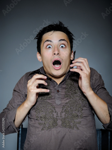Photos Expressions. Handsome man is terrified and feeling fear . open m