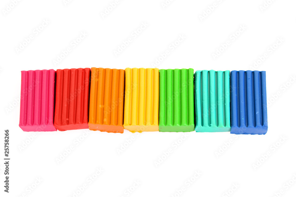 Childen's bright colour plasticine in the raw isolated on white Childen's bright colour plasticine in the raw isolated on white