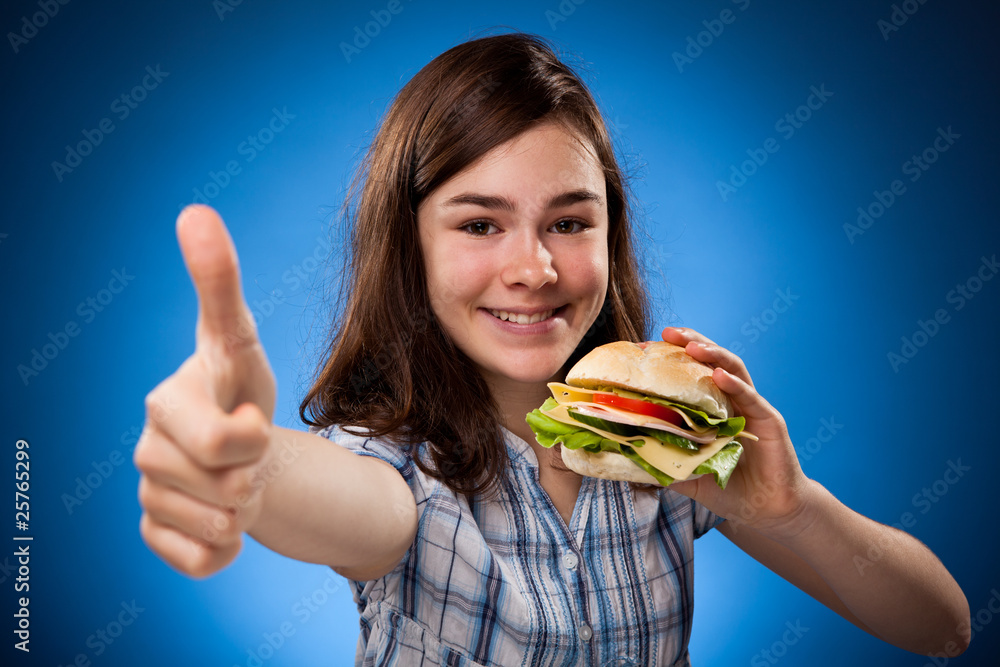 Girl eating big sandwich Girl eating big sandwich