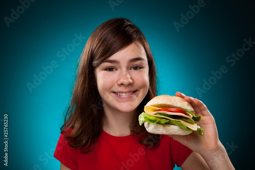 Girl eating big sandwich
