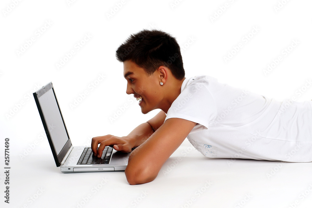 Portrait of a young Asian man using laptop on white background Portrait of a young Asian man using laptop on white background