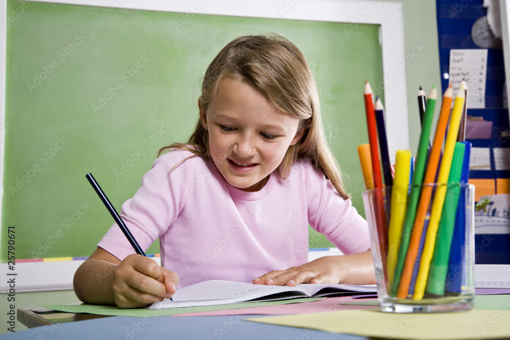 Close-up of school girl writing in notebook Close-up of school girl writing in notebook