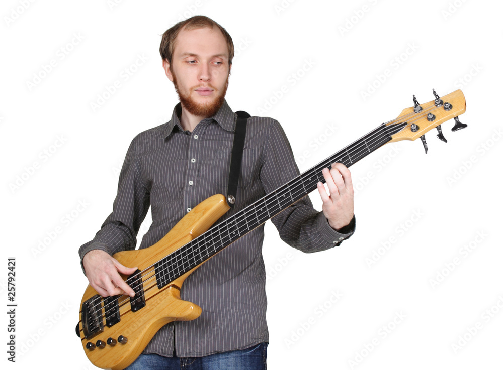young man with beard in grey shirt playing bass guitar, half bod