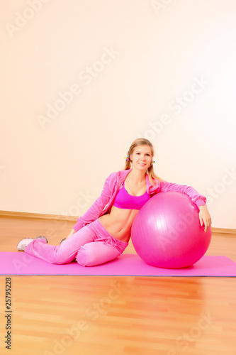 Woman with Exercise ball in gym