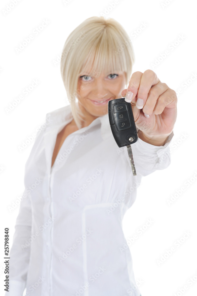 woman holds the key to the car