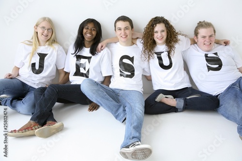 Five Teenagers With T-Shirts Spelling Jesus