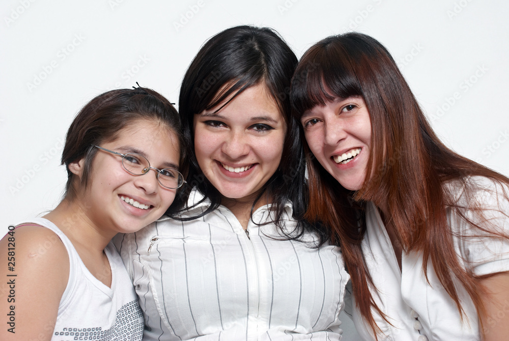 happy sisters smiling isolated over a white background happy sisters smiling isolated over a white background