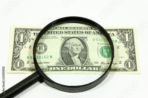 US dollar with magnifying glass