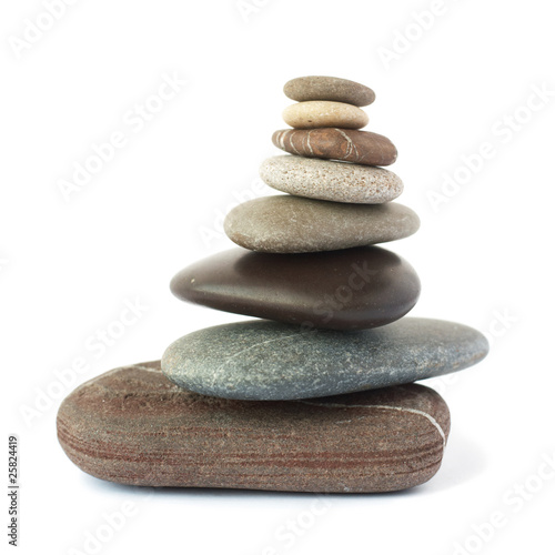 Pebble stones tower isolated on white background.